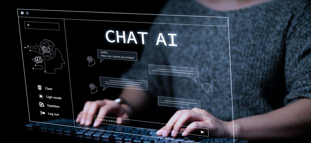Student using an AI prompt at a computer. Student using an AI prompt at a computer.